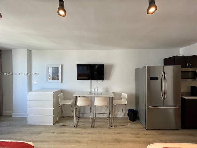 living room with light hardwood / wood-style flooring