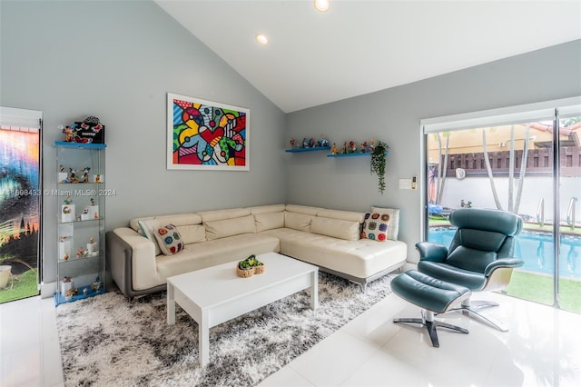 tiled living room with lofted ceiling