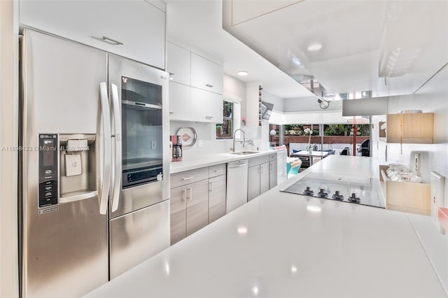 kitchen with white cabinets, sink, and stainless steel appliances