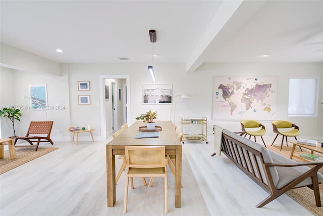 dining area with light wood-type flooring