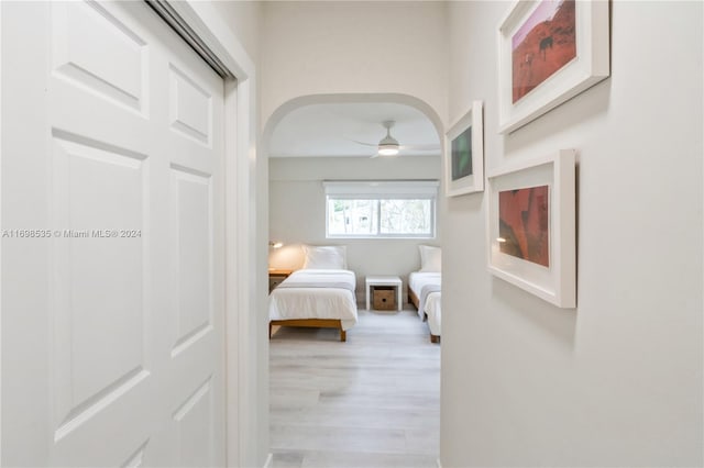 bedroom with ceiling fan and light hardwood / wood-style floors