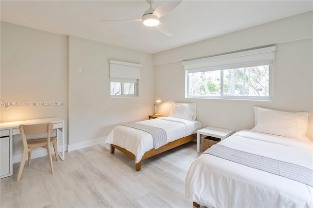 bedroom featuring light wood-type flooring and ceiling fan