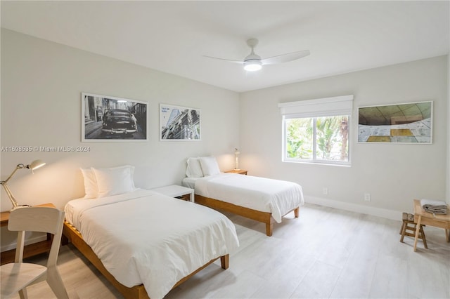 bedroom featuring ceiling fan and light hardwood / wood-style flooring