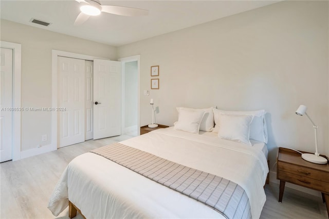 bedroom with ceiling fan and light wood-type flooring