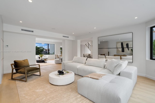 living room with light hardwood / wood-style floors