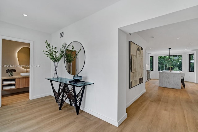 hallway featuring light wood-type flooring