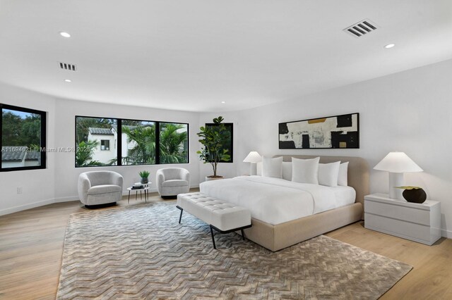 bedroom with light hardwood / wood-style floors