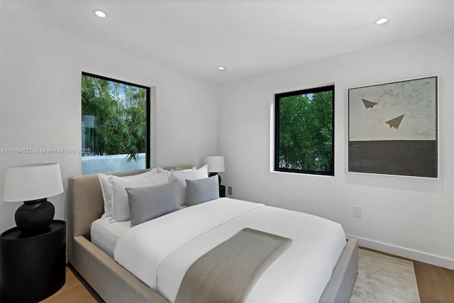 bedroom with light hardwood / wood-style flooring