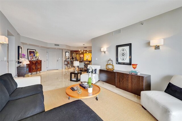 living room featuring an inviting chandelier