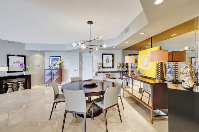 dining room with a chandelier