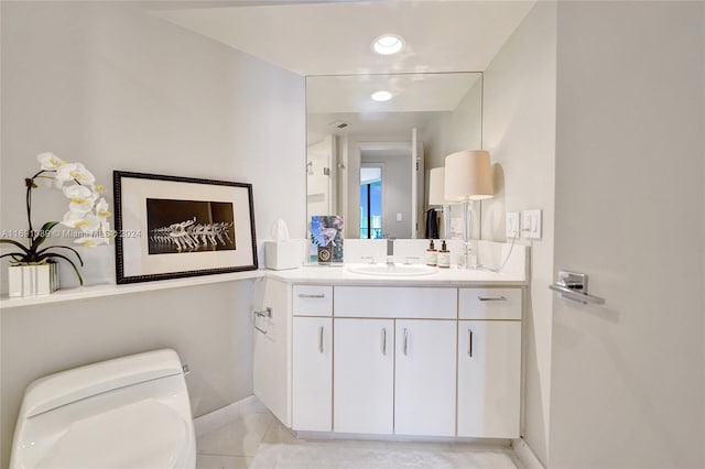 bathroom featuring vanity and toilet