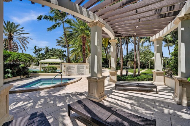 view of patio / terrace with a pergola and a swimming pool with hot tub