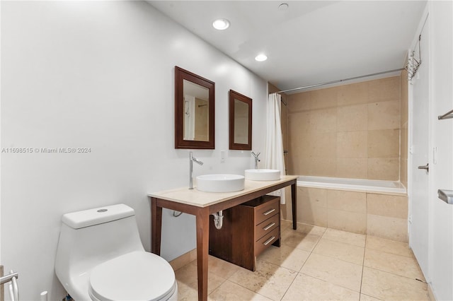 full bathroom featuring toilet, shower / bath combination with curtain, tile patterned floors, and sink