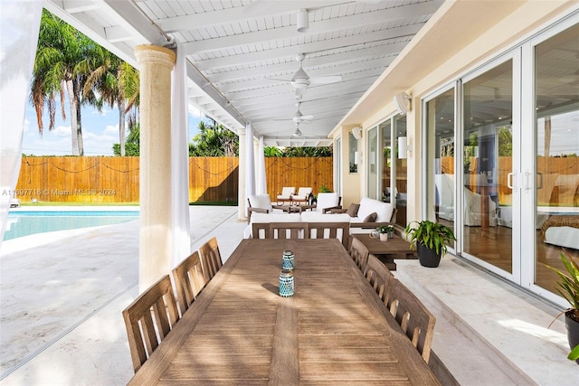 view of patio featuring french doors, a fenced in pool, and ceiling fan