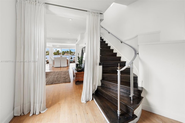 staircase featuring hardwood / wood-style floors