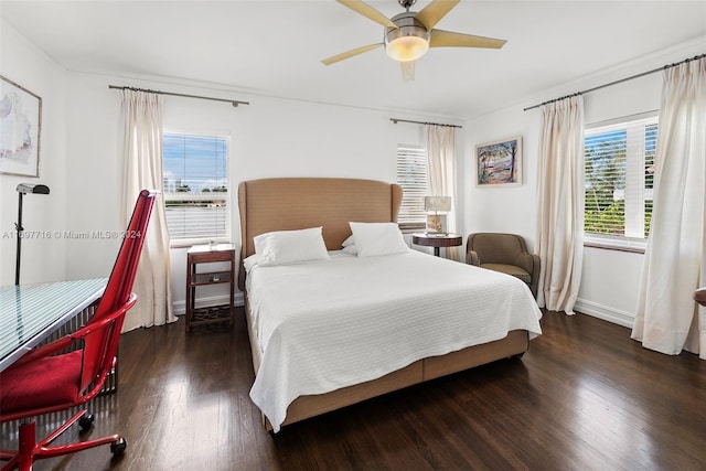 bedroom with ceiling fan and dark hardwood / wood-style flooring