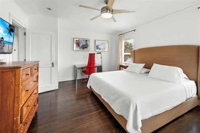 bedroom featuring dark hardwood / wood-style flooring and ceiling fan