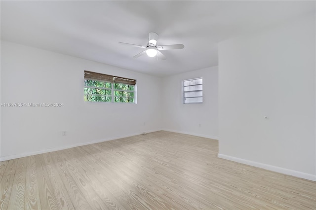 spare room with ceiling fan and light hardwood / wood-style floors