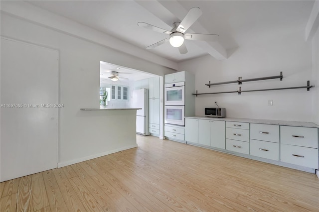 kitchen featuring white appliances, light hardwood / wood-style flooring, white cabinetry, and ceiling fan