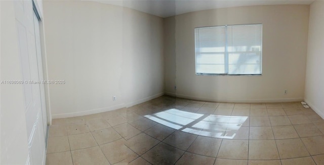 empty room featuring light tile patterned floors