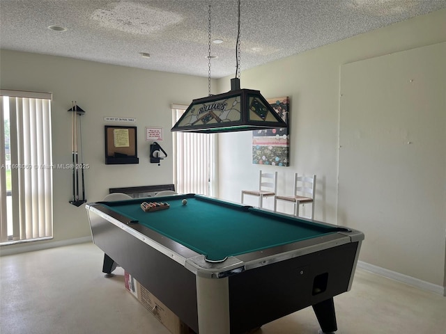 recreation room featuring a textured ceiling and billiards