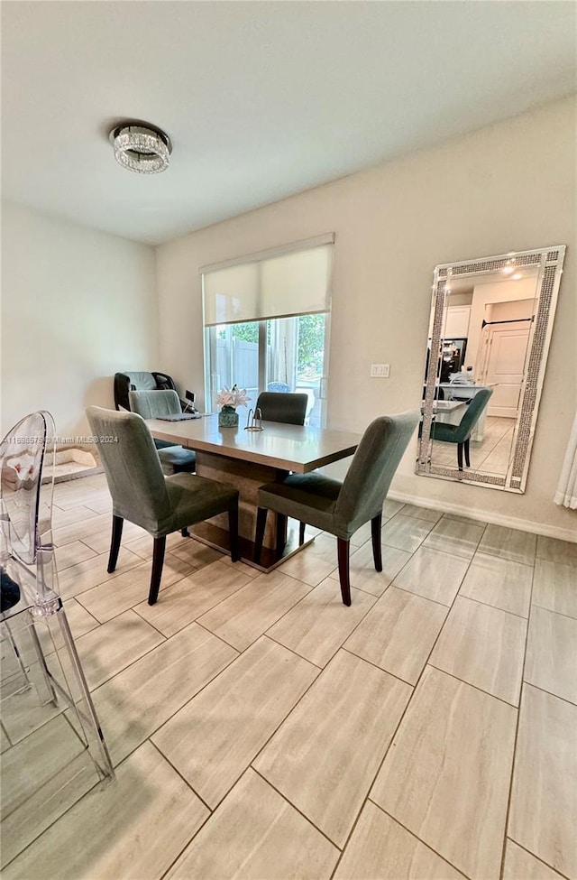 dining area featuring light wood-type flooring