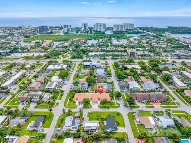 birds eye view of property featuring a water view