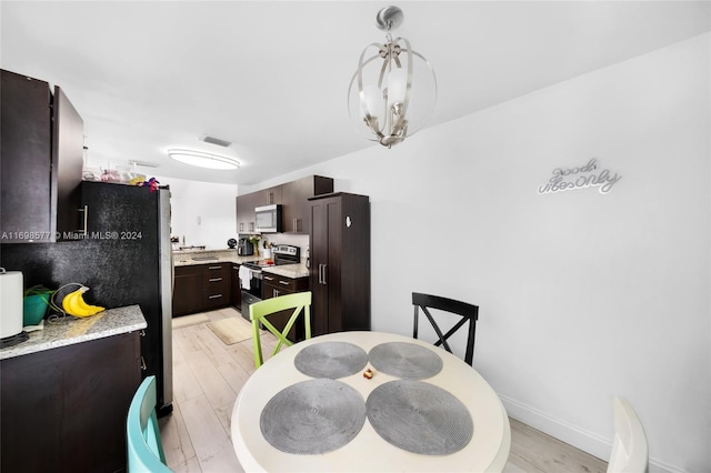 dining area featuring light wood-type flooring