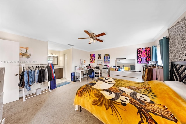 bedroom with crown molding, ceiling fan, ensuite bathroom, and light carpet