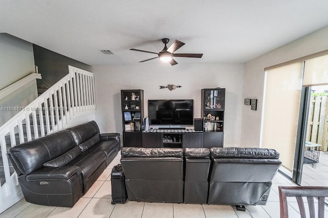 living room featuring ceiling fan and light tile patterned floors