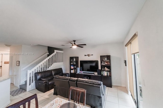 tiled living room featuring ceiling fan