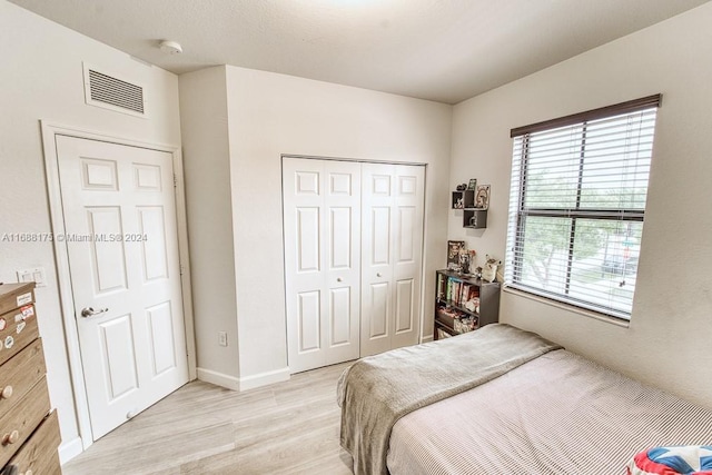 bedroom with light hardwood / wood-style floors