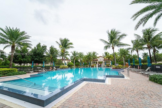 view of swimming pool featuring a patio area