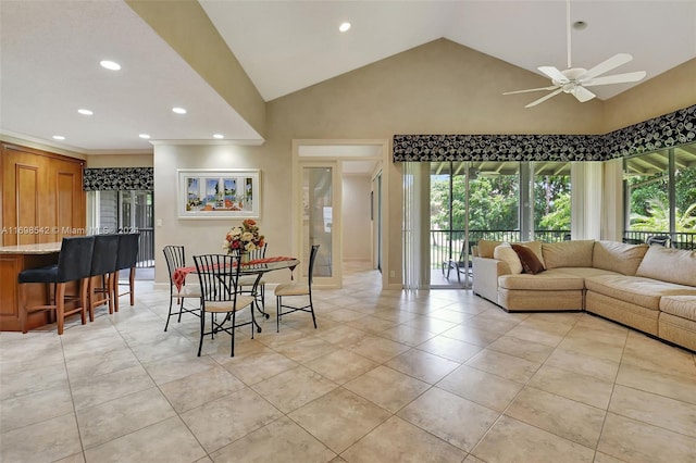 dining room featuring light tile patterned floors, high vaulted ceiling, and ceiling fan