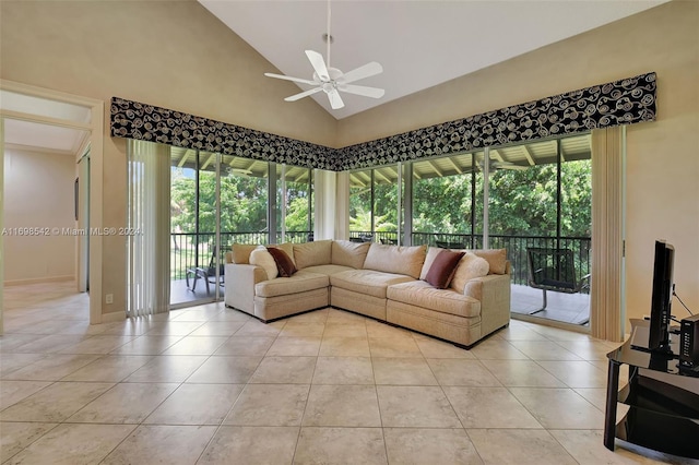 living room featuring a wealth of natural light, high vaulted ceiling, light tile patterned floors, and ceiling fan