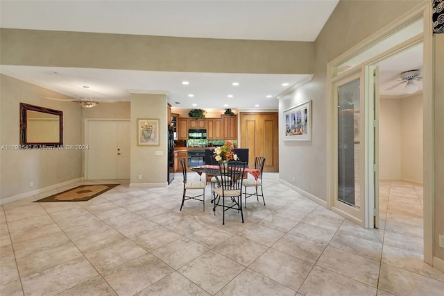 dining room featuring light tile patterned floors, ceiling fan, and crown molding