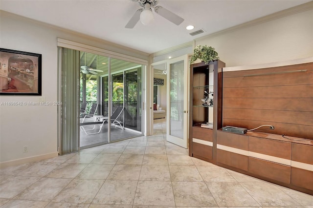 unfurnished room with ceiling fan, light tile patterned flooring, ornamental molding, and french doors