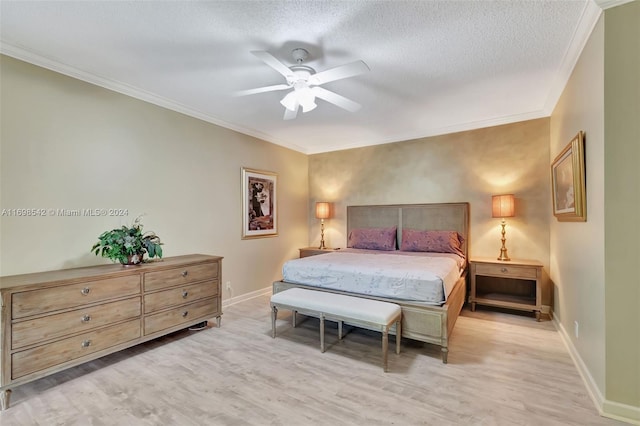 bedroom with ceiling fan, crown molding, light hardwood / wood-style floors, and a textured ceiling