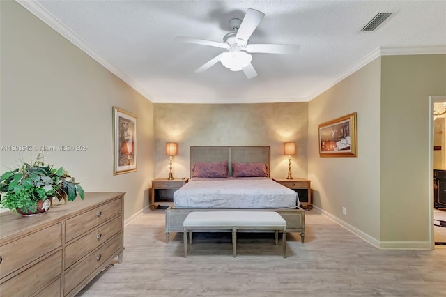 bedroom with ceiling fan, light hardwood / wood-style flooring, crown molding, and a textured ceiling