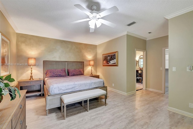 bedroom with ceiling fan, ornamental molding, a textured ceiling, and light wood-type flooring