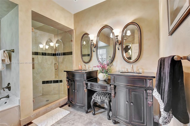 bathroom with vanity and independent shower and bath