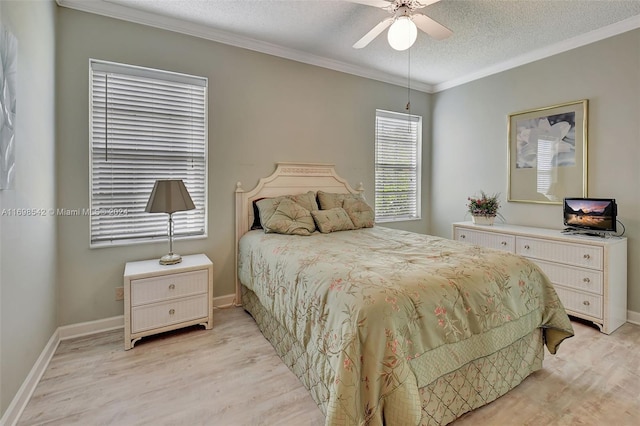 bedroom with ceiling fan, ornamental molding, a textured ceiling, and light wood-type flooring