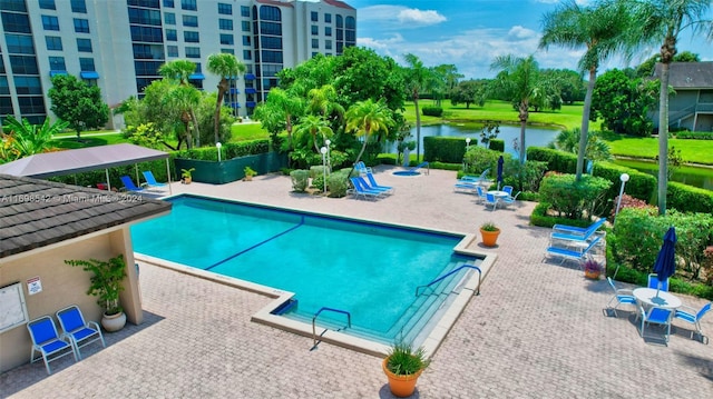 view of pool featuring a gazebo, a patio area, and a water view