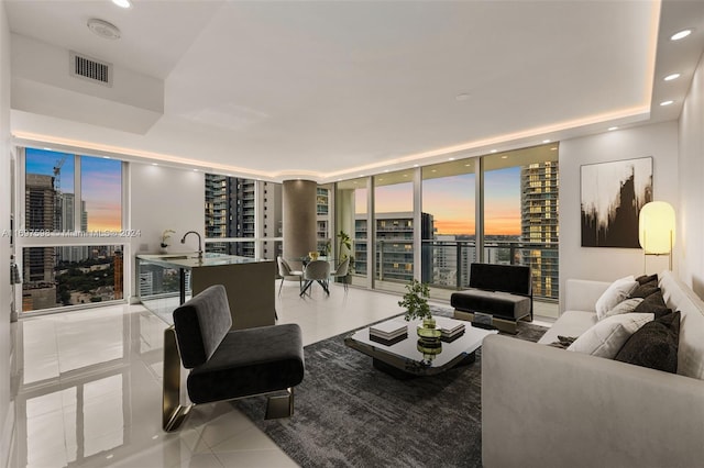 tiled living room with floor to ceiling windows