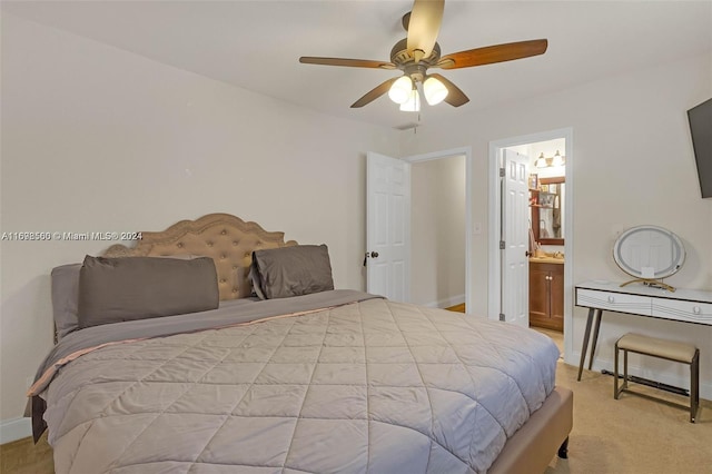 carpeted bedroom featuring ceiling fan and connected bathroom