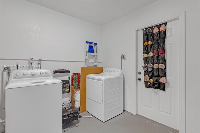 laundry area with independent washer and dryer