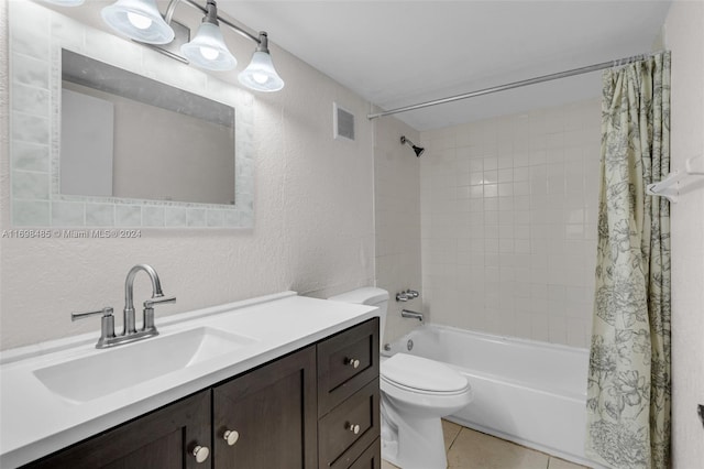 full bathroom featuring tile patterned flooring, vanity, shower / tub combo with curtain, and toilet