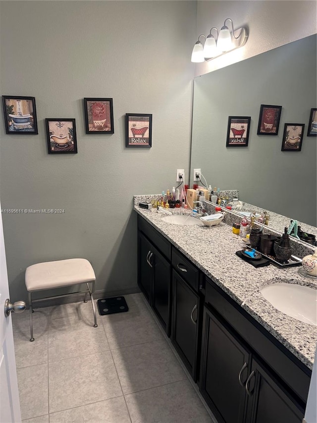 bathroom with tile patterned flooring and vanity