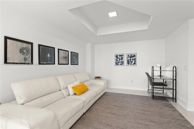 living room with a tray ceiling