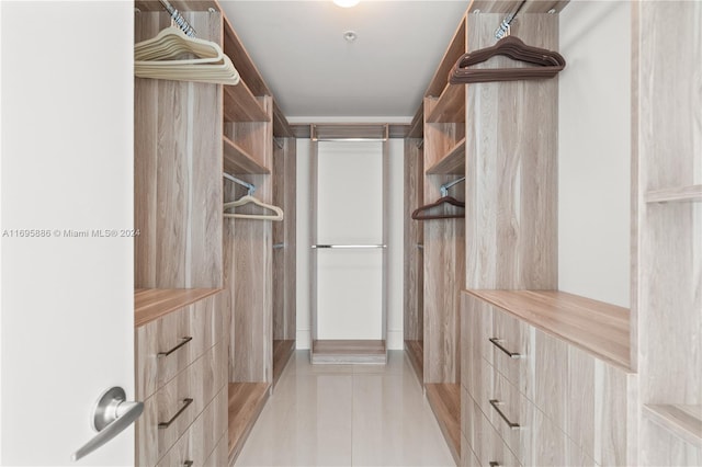 walk in closet featuring light tile patterned floors